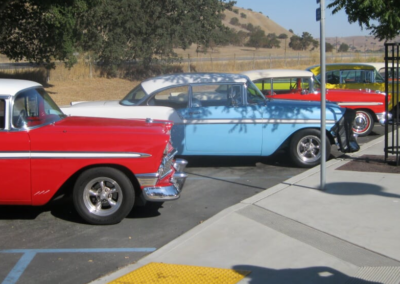 Five classic Chevy Bel Air models parked.